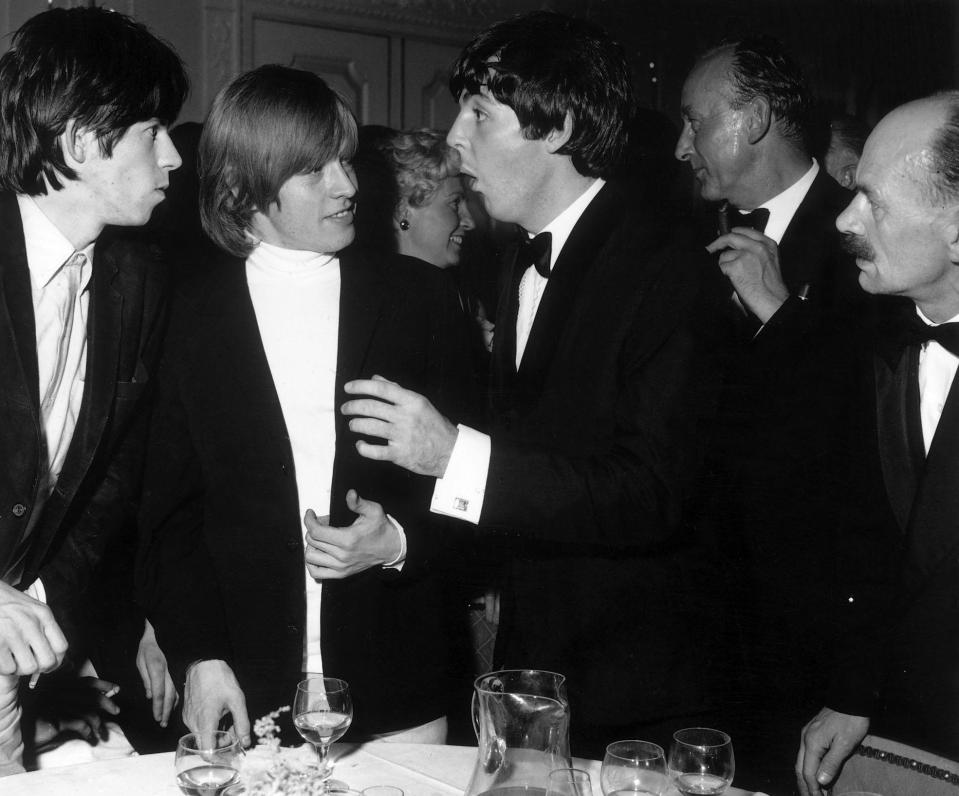 Keith, left, and late fellow Stone, Brian Jones chatting with Paul McCartney in 1964