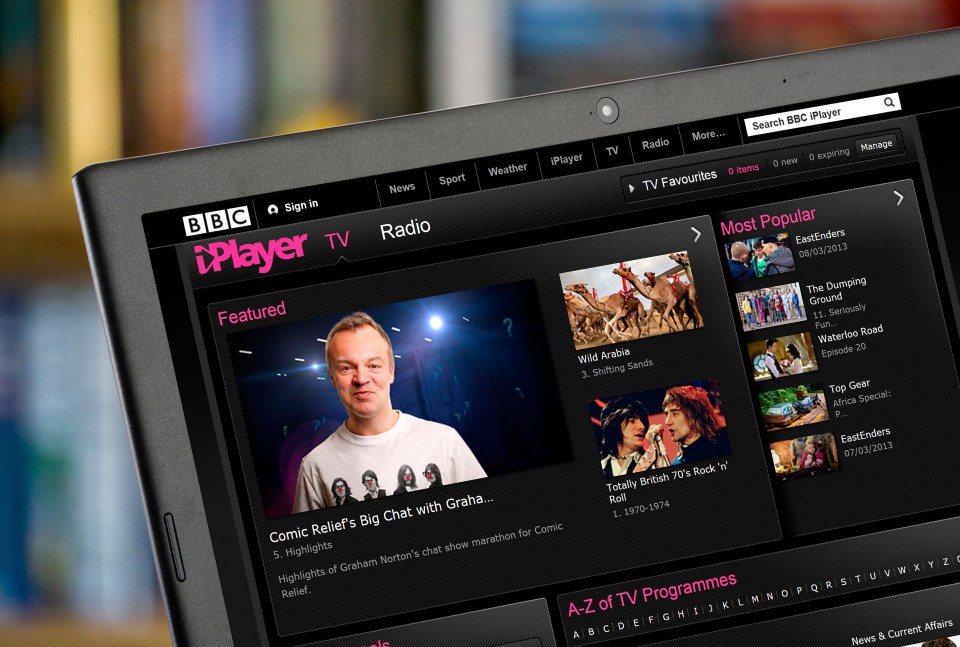 D49J25 Watching TV via BBC iPlayer on a laptop computer