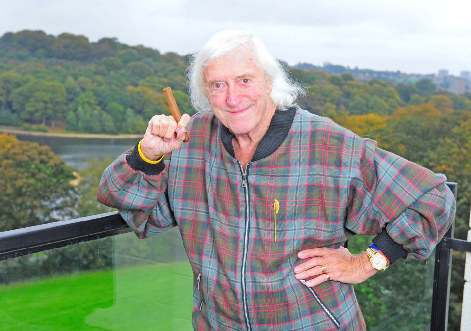 Evil Savile smirking at his penthouse flat in Leeds in October 2010, a year before he died