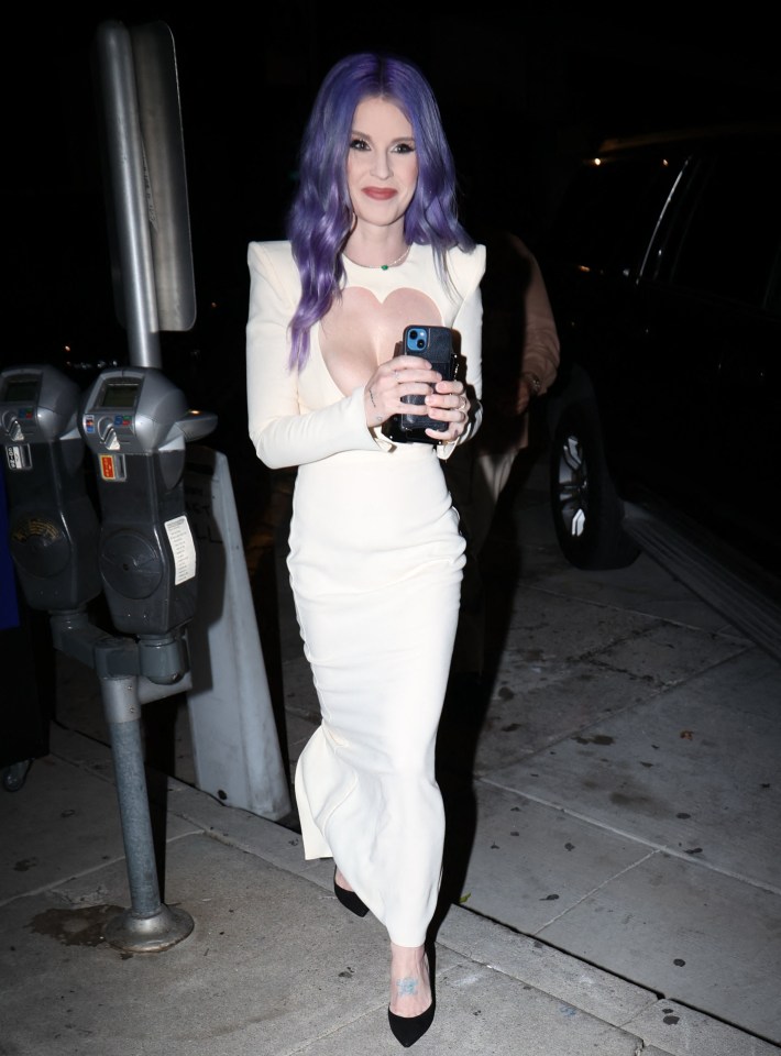 Kelly wore a slashed cream dress which featured a heart shaped front