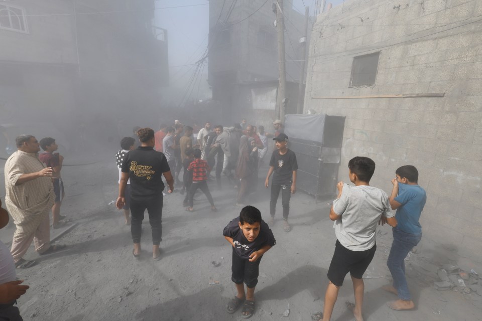 Children cough as others rush to help the wounded inside Gaza