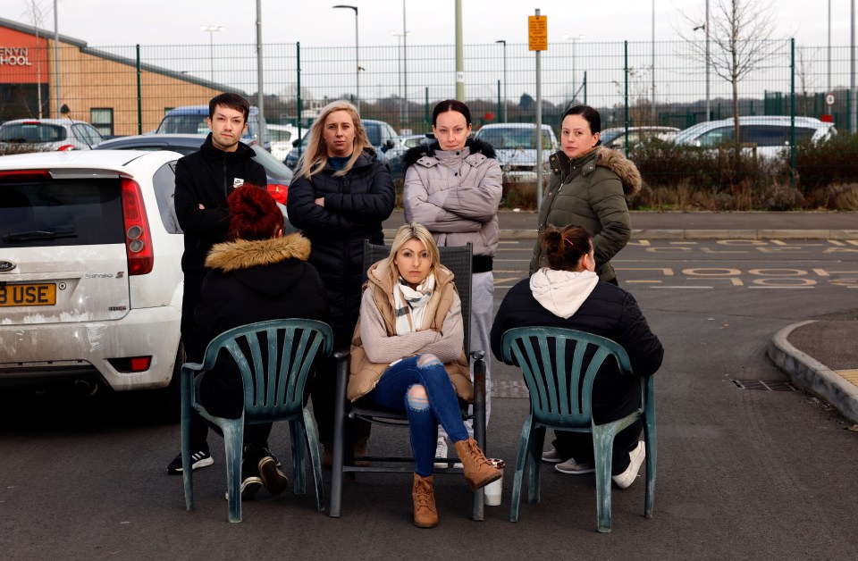 The feud comes as mums decided to create a road barricade with chairs