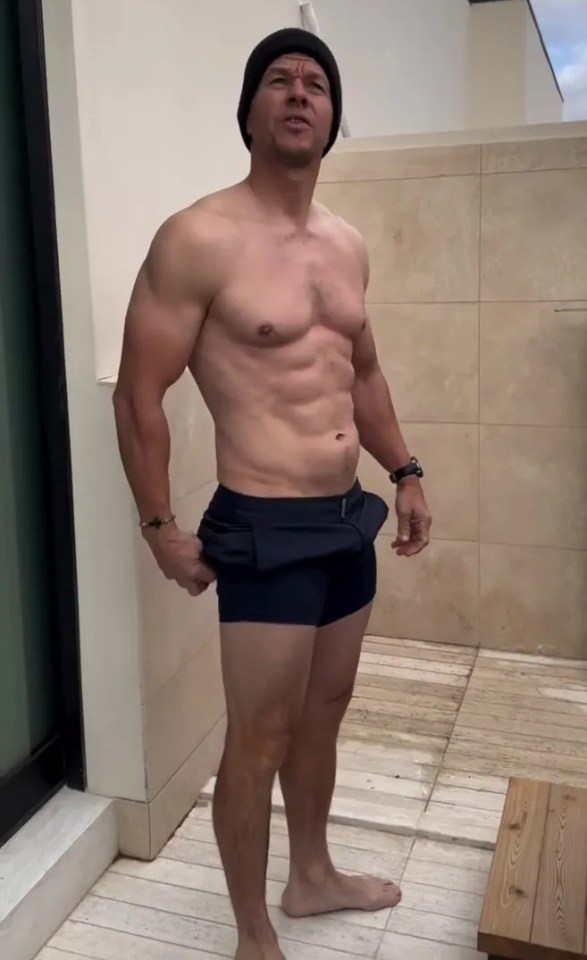 Actor Mark Wahlberg shows off his incredible physique as he strips off for an ice bath