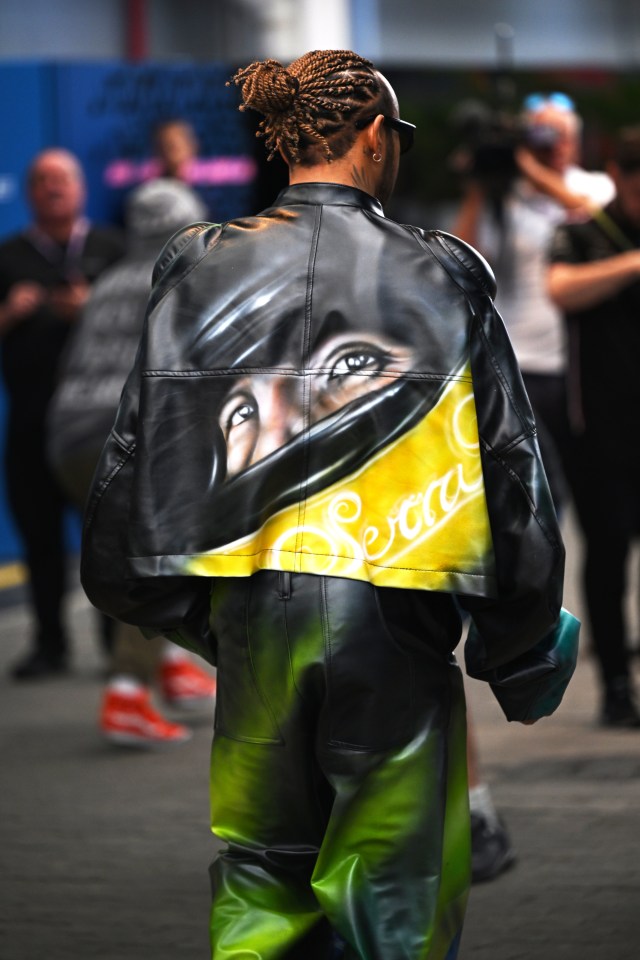 The outfit had a spray-painted image of the late Senna on the back of it