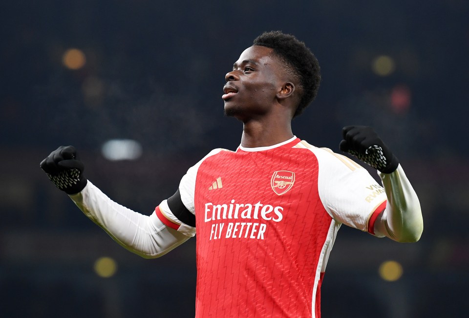 LONDON, ENGLAND - NOVEMBER 29: Bukayo Saka of Arsenal celebrates after scoring the team's third goal during the UEFA Champions League match between Arsenal FC and RC Lens at Emirates Stadium on November 29, 2023 in London, England. (Photo by Stuart MacFarlane/Arsenal FC via Getty Images)