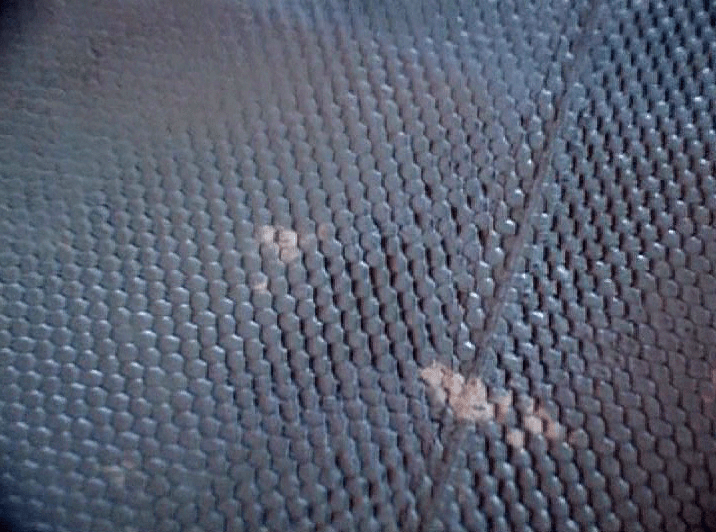 One of the pieces of debris is a strange honeycomb like metal