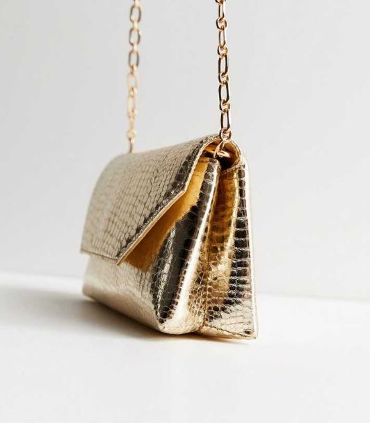 New Look's gold clutch bag looks just like the £700 designer Mulberry version but is only £18 and perfect for a night out, , http://www.newlook.com/uk/womens/accessories/bags/gold-faux-croc-chain-clutch-bag/p/879542693