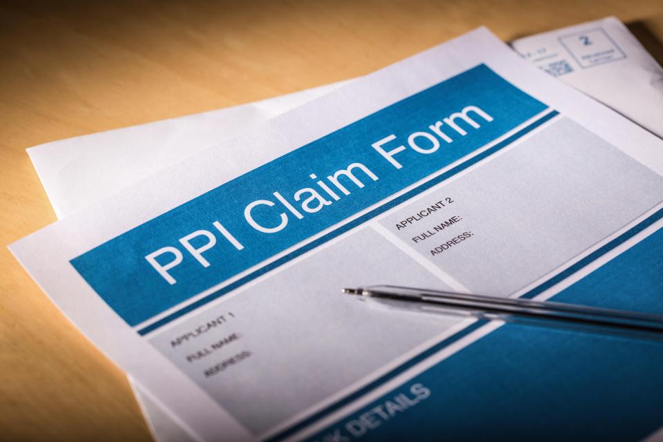 a pen sits on top of a ppi claim form