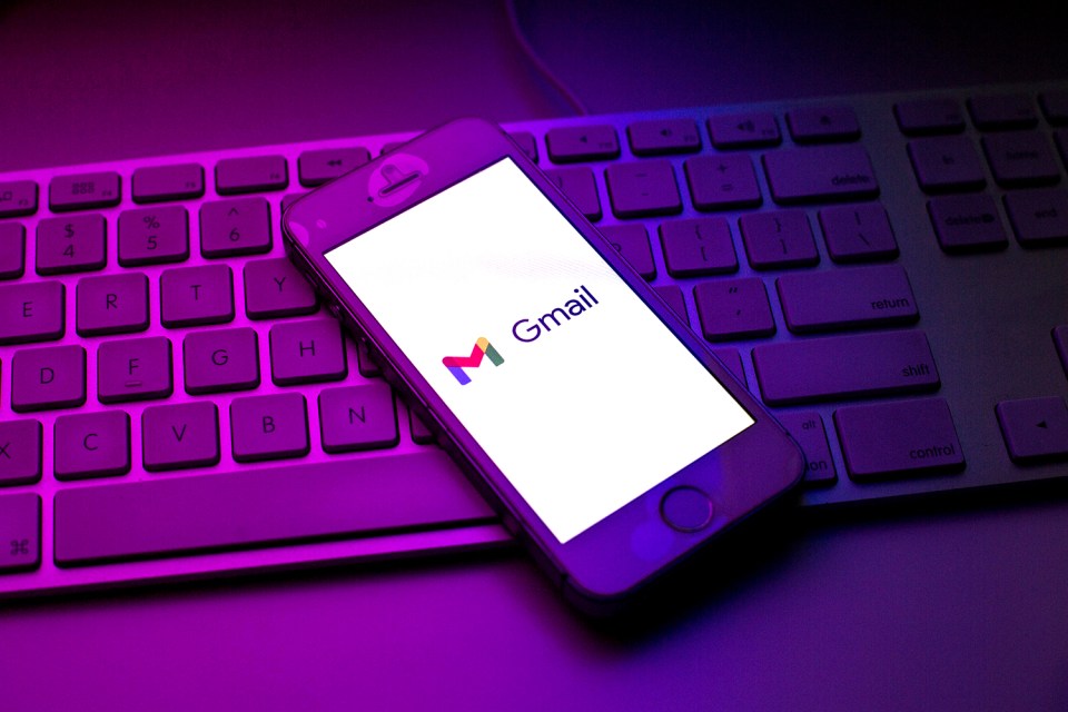 a phone with the word gmail on the screen