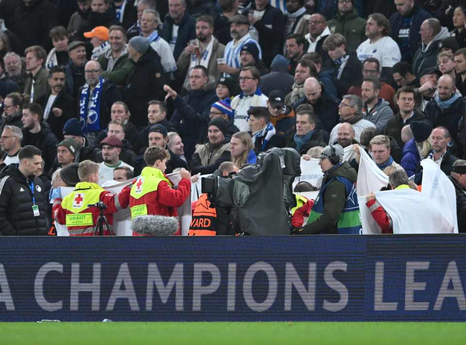 Medical staff created a screen of privacy while others treated the supporter