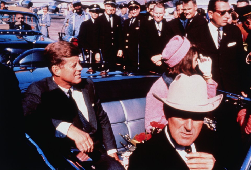 John and Jackie Kennedy driving through Dallas moments before the assassination behind Texas Governor John Connally