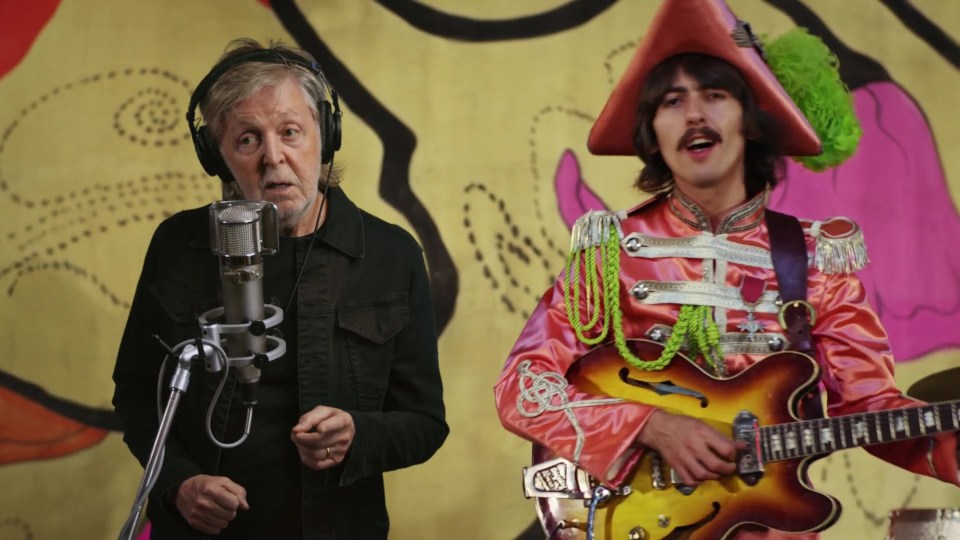 Sir Paul McCartney sings as a super-imposed George Harrison plays alongside him