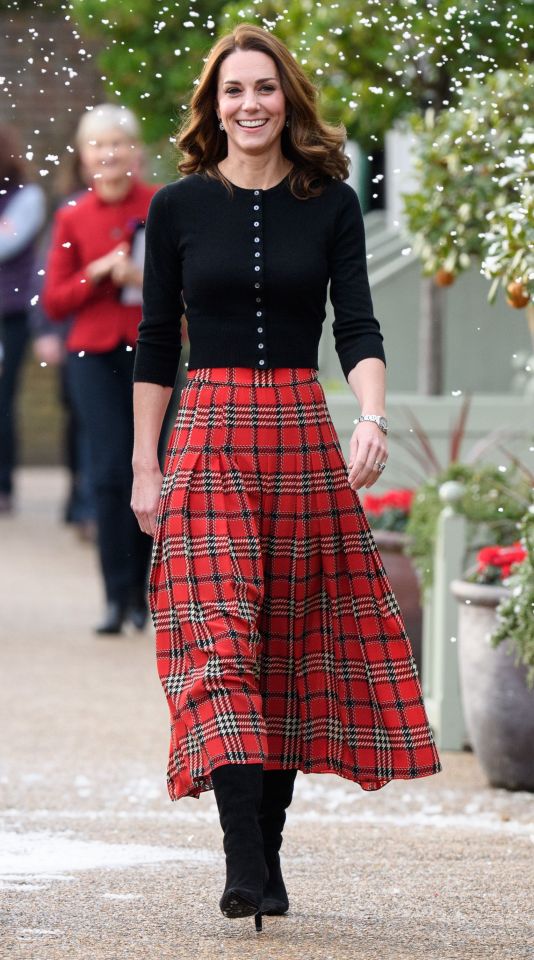 Kate uses chooses red or green themed ensembles, like this tartan skirt in 2018