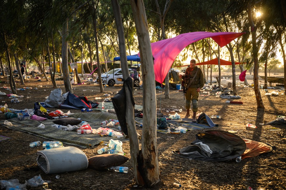 2023 Year in Review - NEWS RE'IM, ISRAEL - OCTOBER 12: Members of the security forces continue to search for identification and personal effects at the Supernova Music Festival site, where hundreds were killed and dozens taken by Hamas militants near the border with Gaza, on October 12, 2023 in Kibbutz Re'im, Israel. Israel has sealed off Gaza and launched sustained retaliatory air strikes, which have killed at least 1,200 people with more than 300, 000 displaced, after a large-scale attack by Hamas. On October 7, the Palestinian militant group Hamas launched a surprise attack on Israel from Gaza by land, sea, and air, killing over 1,200 people and wounding around 2800. Israeli soldiers and civilians have also been taken hostage by Hamas and moved into Gaza. The attack prompted a declaration of war by Israeli Prime Minister Benjamin Netanyahu and the announcement of an emergency wartime government. (Photo by Leon Neal/Getty Images)
