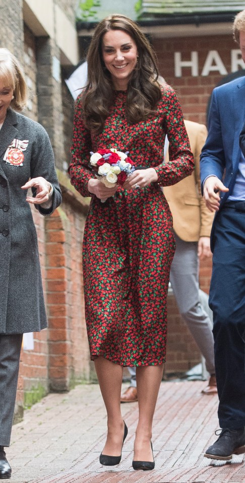 Kate in a red floral as she attended a Christmas party for volunteers at The Mix youth service in 2019
