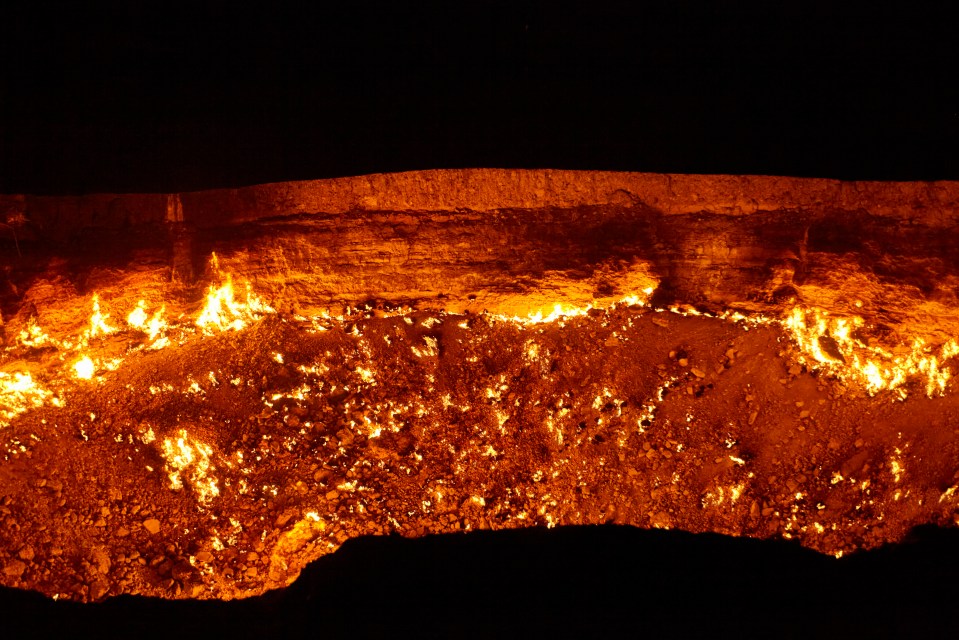 a cliff with a lot of fire coming out of it