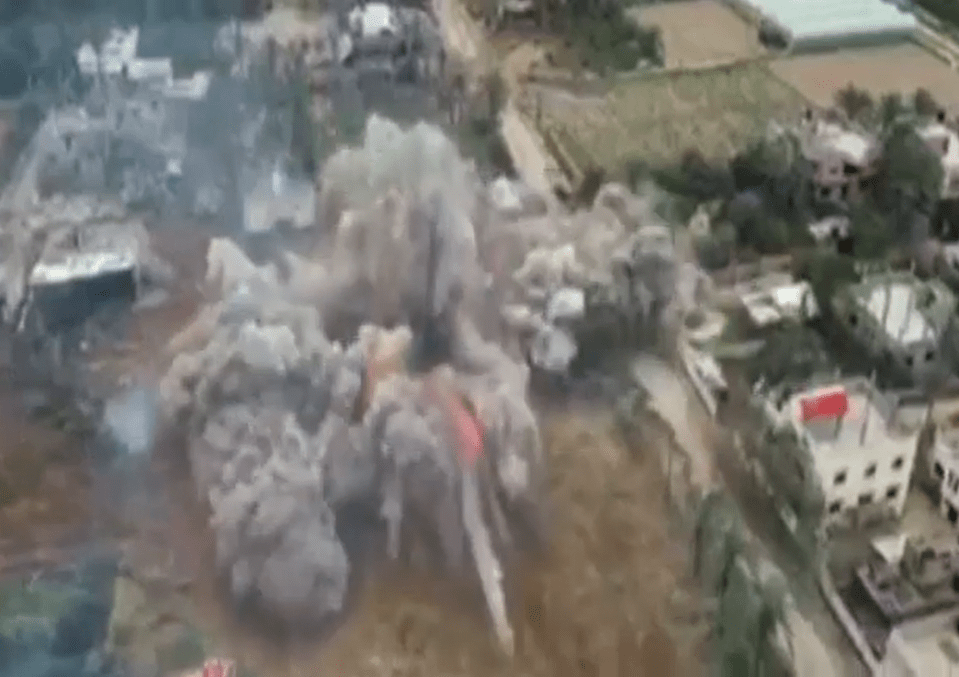 The moment The Guest's home is blown up creating a cloud of fire and dust