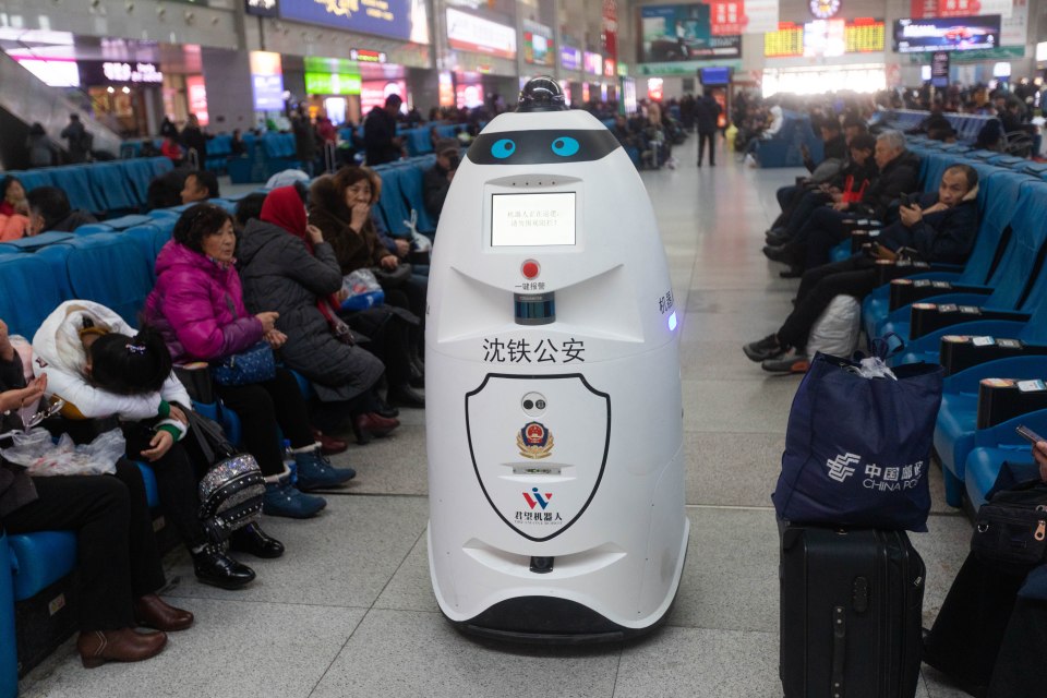 CHANGCHUN, CHINA - DECEMBER 02: A police robot patrols at Changchun Railway Station on December 2, 2019 in Changchun, Jilin Province of China. The police robot can patrol, monitor and also can recognize passengers' faces to compare with the faces of the escaped criminals. (Photo by VCG/VCG via Getty Images)