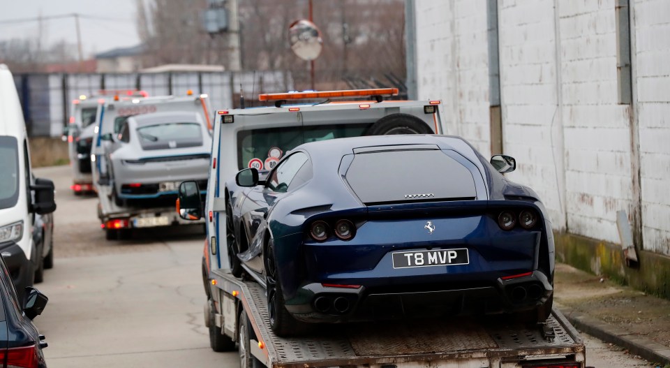 A Ferrari is seized from the Tates and towed away by cops