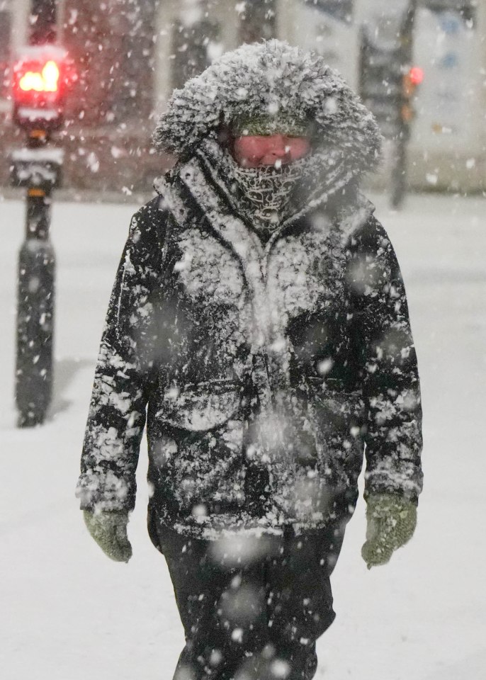 A walker battles the elements in Bridlington