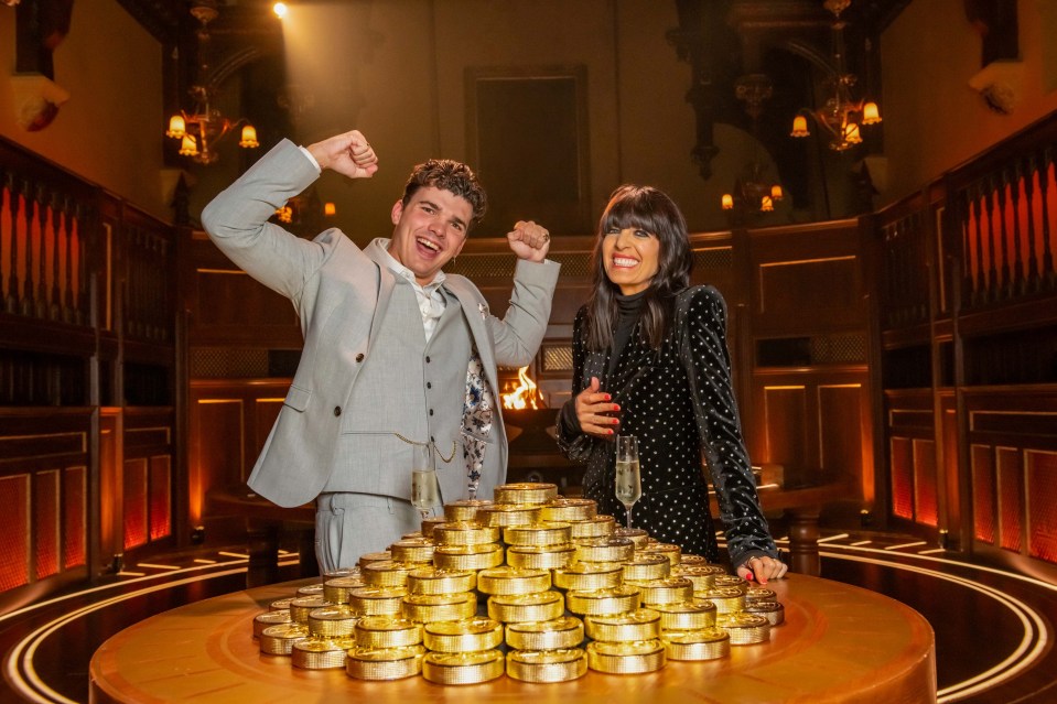 Harry and Claudia Winkleman celebrating with a large pile of gold coins on the set of The Traitors II.