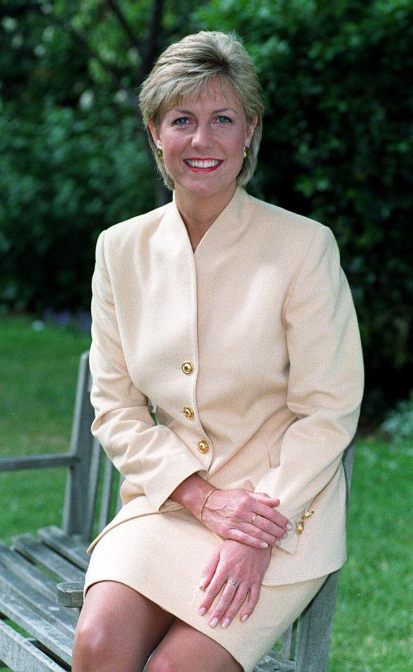 Jill Dando, television presenter, seated outdoors.