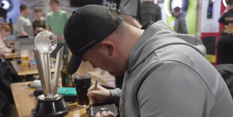 Littler signs goodies for his young fans
