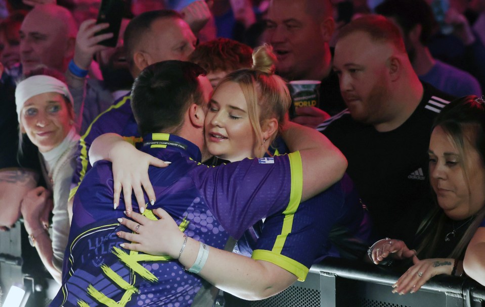 Eloise was on hand to comfort Littler after his heartbreaking defeat in the WDC final