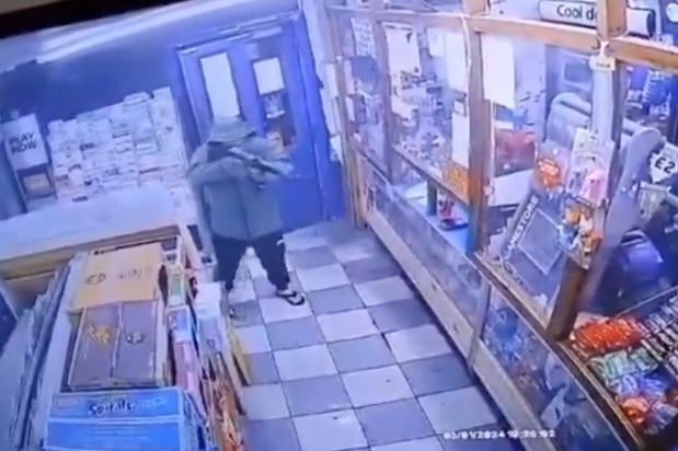 CCTV shows the gunman attempting to rob a shop
