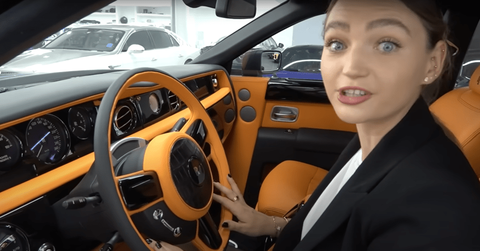 Inside the vehicle are orange seats and a crocodile-leather steering wheel
