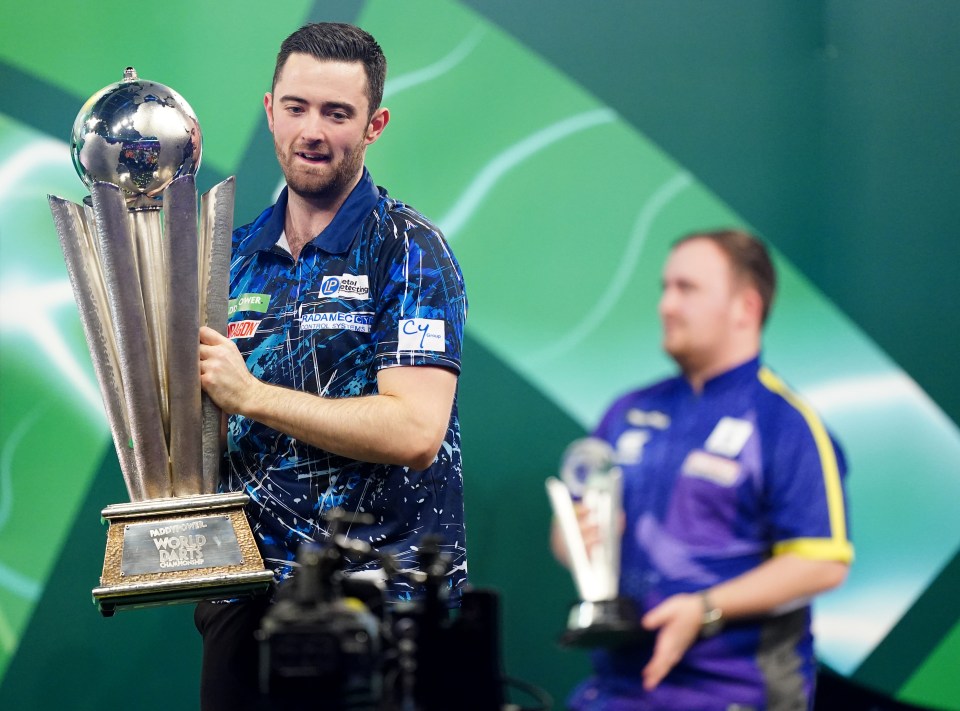 Luke Humphries with the trophy after winning the PDC Darts World Championship
