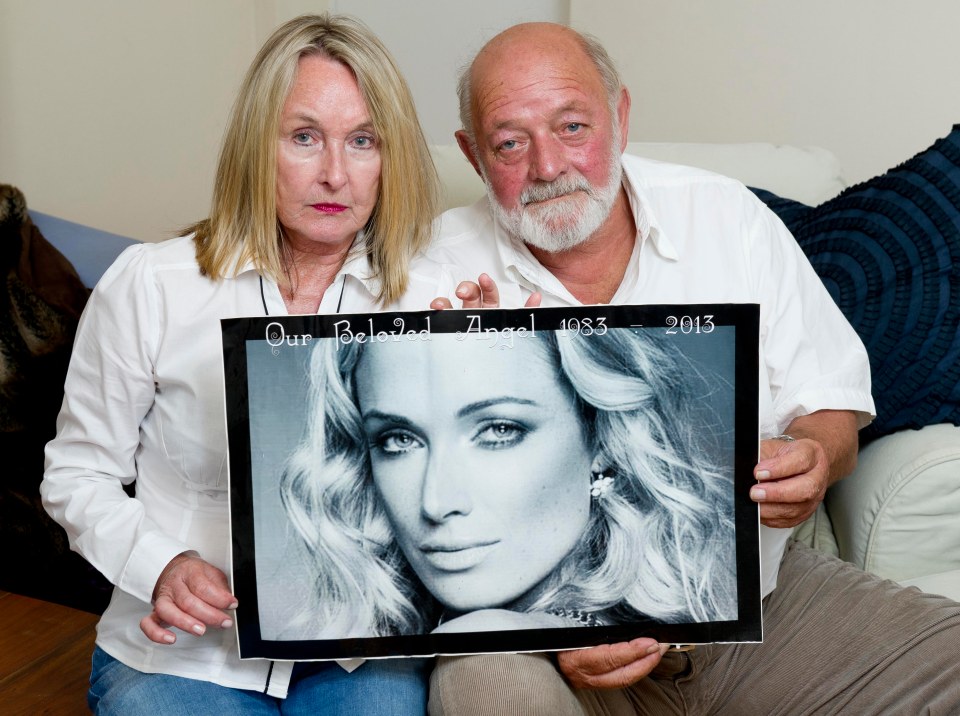 The victim's parents Barry and June during the trial with a snap of murdered daughter Reeva