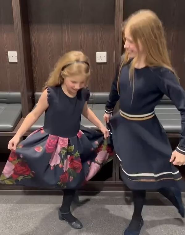 Macy, 11, and Maya, eight, rehearsing their curtsies