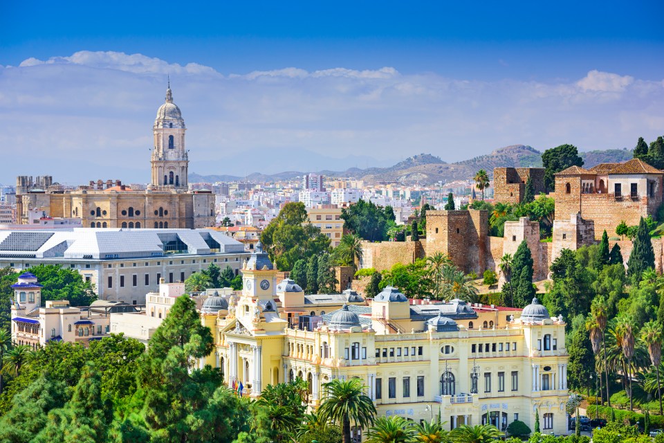 Malaga, Spain cityscape at the Cathedral, City Hall and Alcazaba citadel of Malaga.