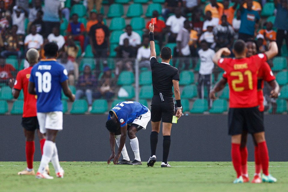 Dahane Beida shows a red to Namibia defender Lubeni Haukongo