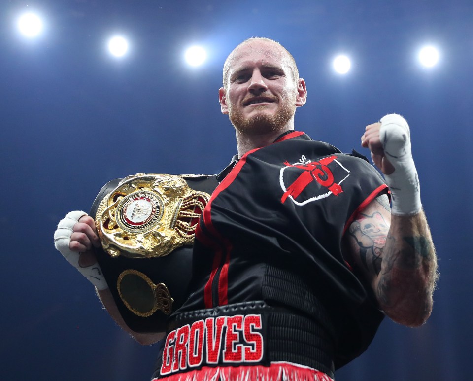 George Groves celebrates a boxing victory, holding a championship belt.