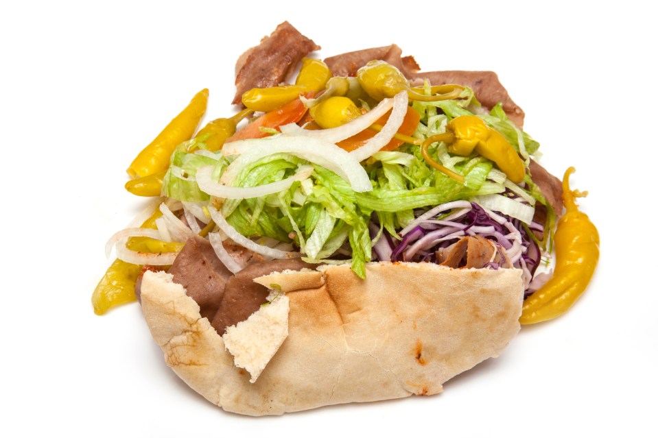 Lamb Doner kebab isolated on a white studio background.Lamb Doner kebab isolated on a white studio background.