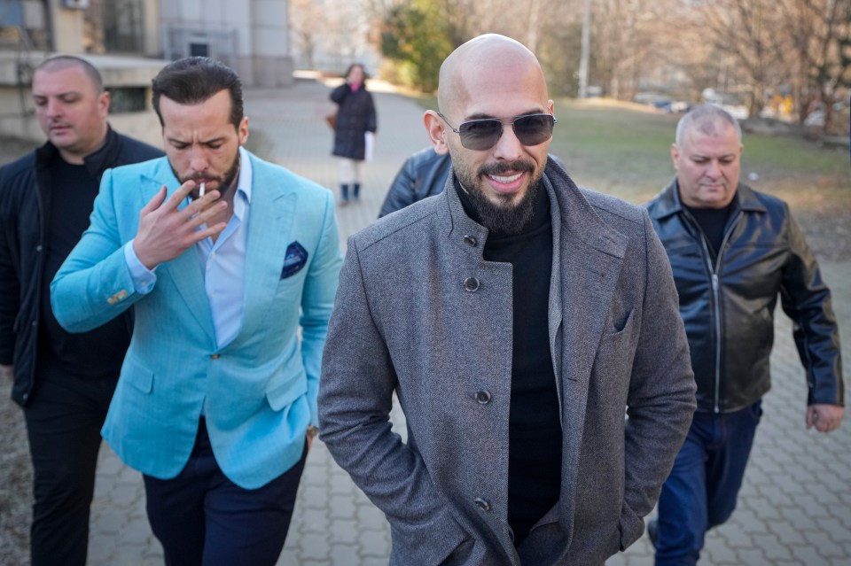 Andrew Tate, front, and his brother Tristan, second left, leave the Bucharest Tribunal in Bucharest, Romania, Thursday, Feb. 1, 2024. (AP Photo/Vadim Ghirda)