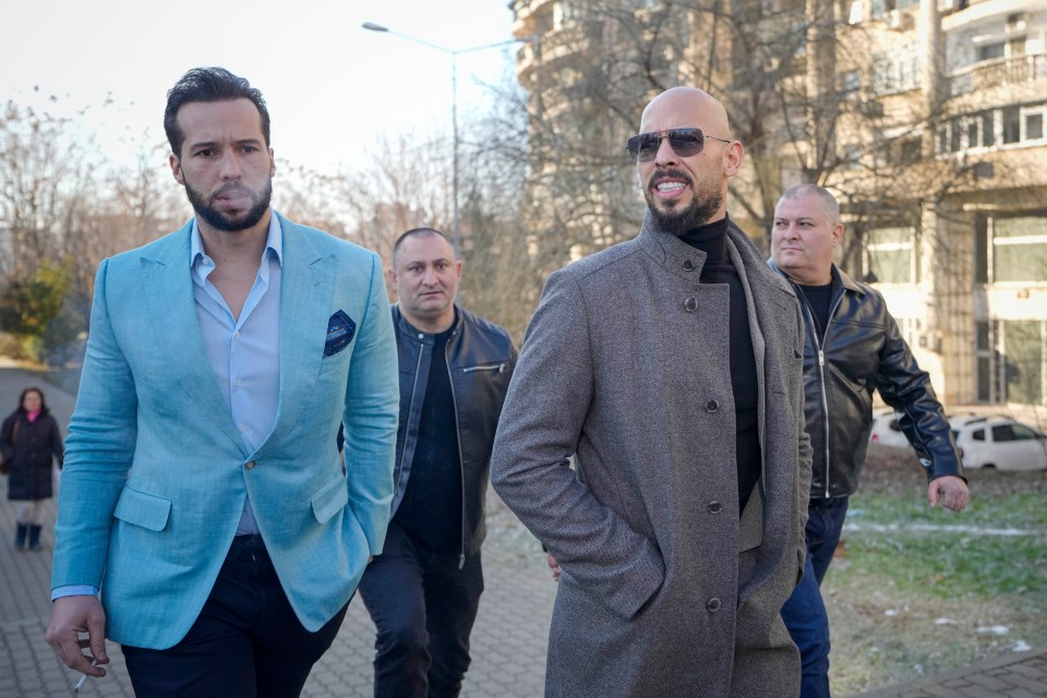Andrew Tate, front right, and his brother Tristan, front left, leave the Bucharest Tribunal in Bucharest, Romania, Thursday, Feb. 1, 2024. (AP Photo/Vadim Ghirda)