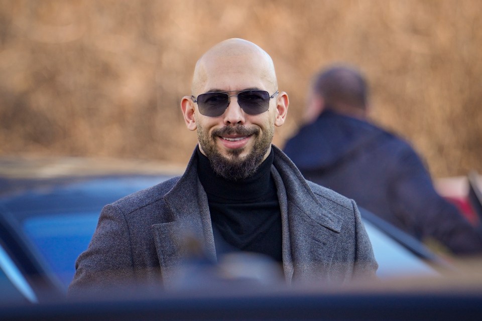Andrew Tate smiles as he arrives at the Bucharest Tribunal in Bucharest, Romania, Thursday, Feb. 1, 2024. (AP Photo/Vadim Ghirda)