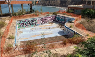 The hotel's swimming pool has dried out and been left to rot