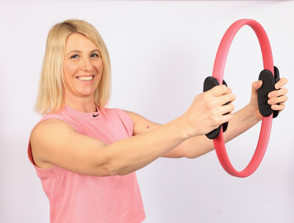 A Pilates ring adds resistance to a workout