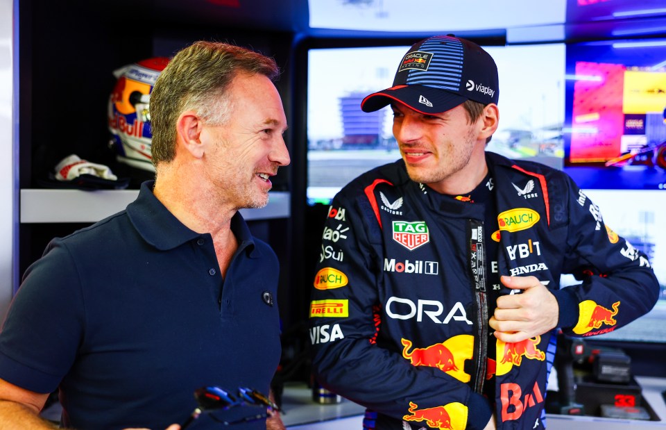 Horner chats with a team member during the pre-season testing in Bahrain