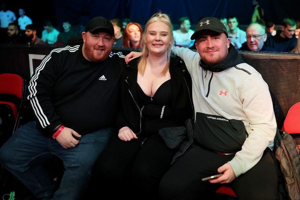 Littler, with partner Eloise here, has shot to stardom after reaching the final of the PDC World Darts Championships