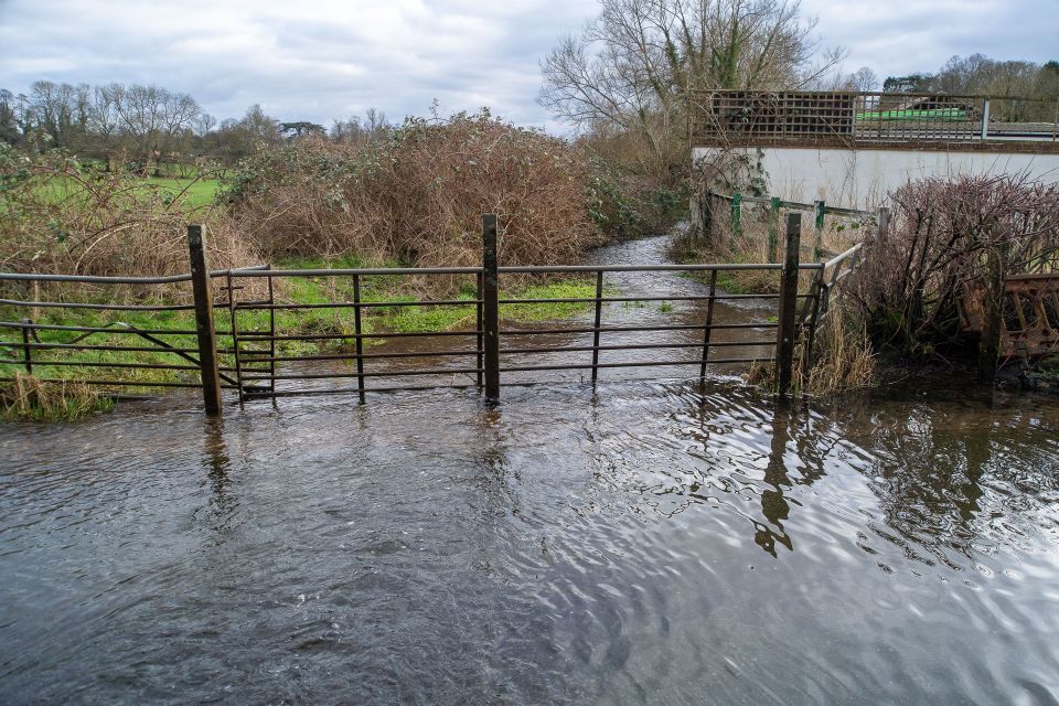 Water levels at the ford in Mill Lane, Chalfont St Giles, Bucks, flooded surrounding fields and roads