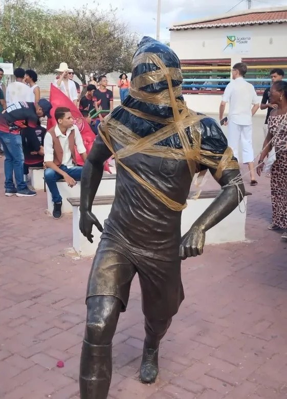 Dani Alves' statue in his hometown, Juazeiro, was wrapped in duct tape and bin bags as locals demand to get it removed