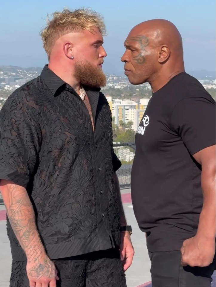 two men standing next to each other with one wearing a shirt that says iron