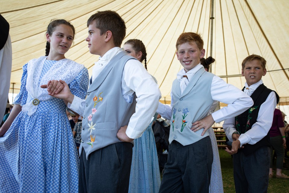 Kids dance at a carnival in 2023