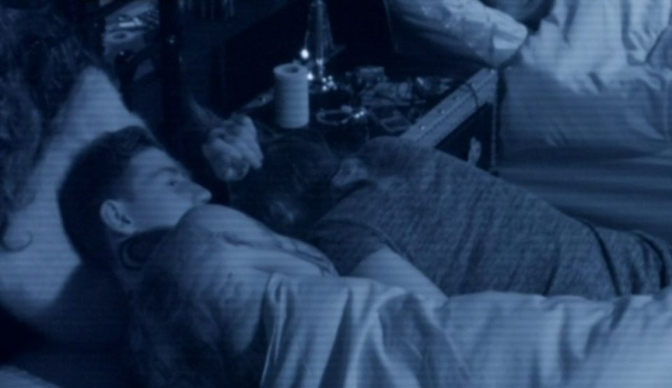 Jeremy McConnell and Stephanie Davis sleeping in bed on the Celebrity Big Brother TV show.