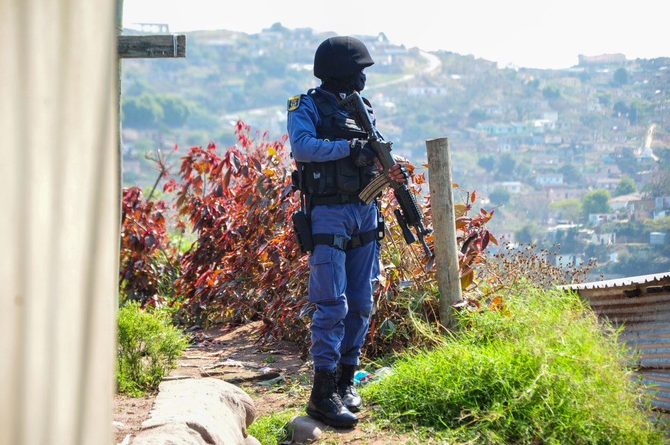 Police at the scene of a 2021 shooting which killed five people